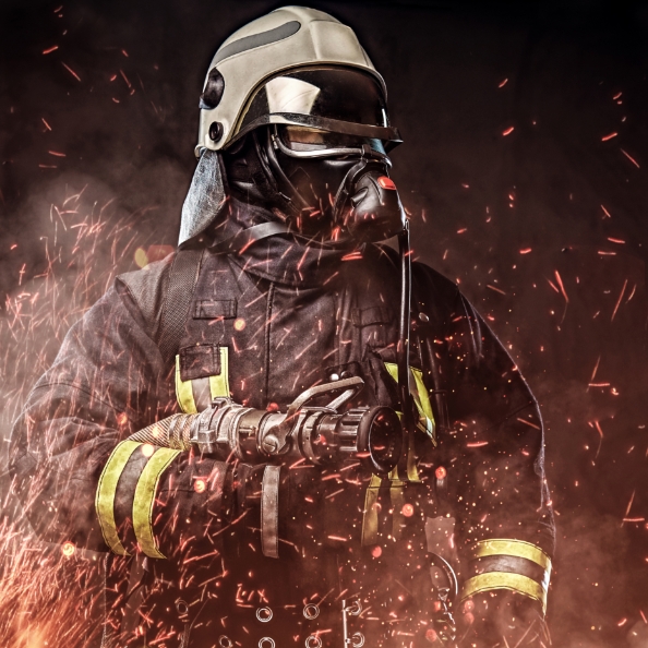 professional-firefighter-dressed-uniform-oxygen-mask-standing-fire-sparks-smoke-dark-background